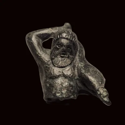 Roman Bronze Figural Fragment of a Bearded Fisherman with Large Fish, c. 1st–3rd Century AD